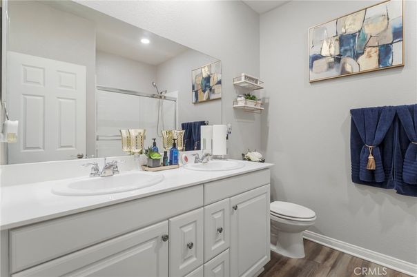 Bathroom, Dual Sink Vanities, Interior, Recessed Lighting, Wood Texture Flooring