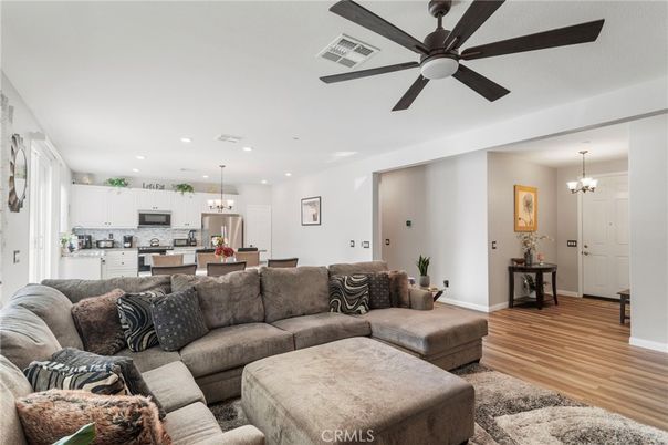 Chandelier, Interior, Kitchen, Living room, Pendant Lights, Recessed Lighting, Stainless Steel Appliances, Wood Texture Flooring