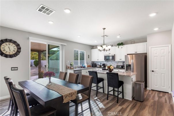 Chandelier, Dining room, Interior, Kitchen, Recessed Lighting, Stainless Steel Appliances, Wood Texture Flooring