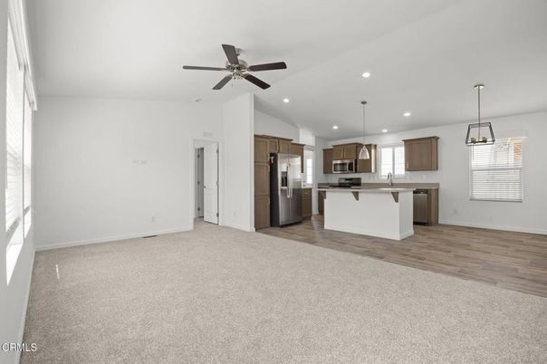 Empty room, Interior, Kitchen, Pendant Lights, Recessed Lighting, Stainless Steel Appliances, Wood Texture Flooring