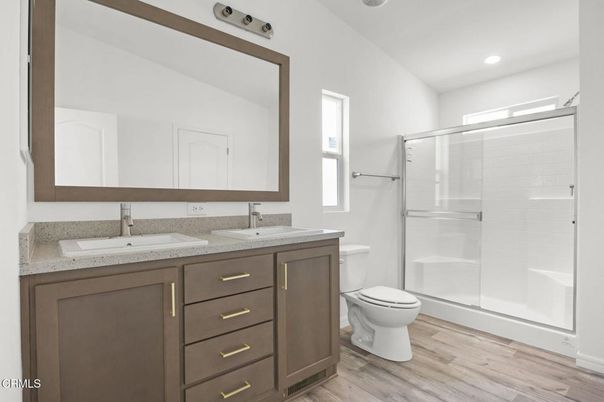 Bathroom, Dual Sink Vanities, Glass Shower, Interior, Recessed Lighting, Wood Texture Flooring