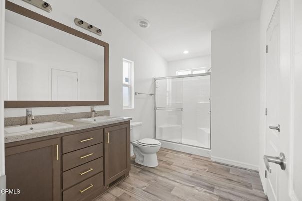 Bathroom, Dual Sink Vanities, Glass Shower, Interior, Recessed Lighting, Wood Texture Flooring