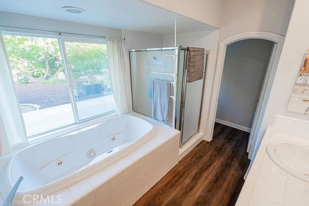 Bathroom, Glass Shower, Interior, Recessed Lighting, Tile Countertops, Wood Texture Flooring