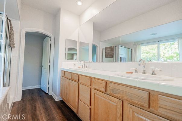 Bathroom, Dual Sink Vanities, Interior, Recessed Lighting, Tile Countertops, Wood Texture Flooring