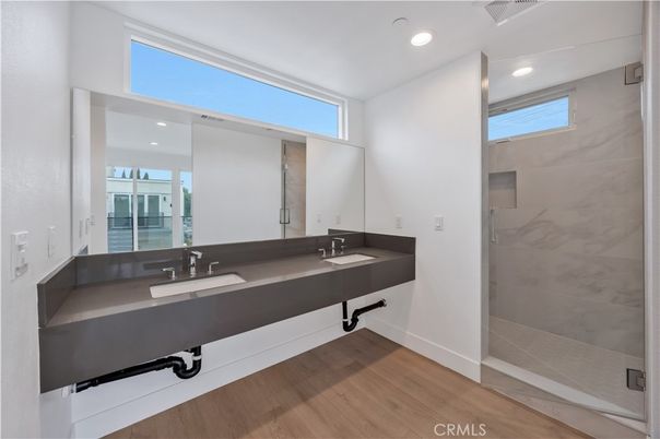 Bathroom, Dual Sink Vanities, Interior, Recessed Lighting, Wood Texture Flooring