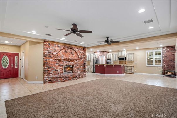 Fireplace, Interior, Kitchen, Recessed Lighting, Stainless Steel Appliances, Stone Walls
