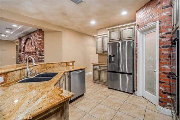 Interior, Kitchen, Recessed Lighting, Stainless Steel Appliances, Stone Walls