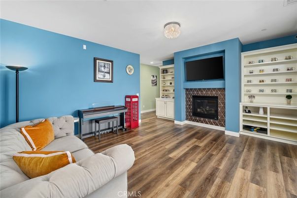 Fireplace, Interior, Living room, Piano, Recessed Lighting, Wood Texture Flooring