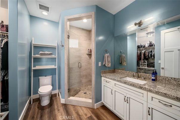 Bathroom, Dual Sink Vanities, Glass Shower, Interior, Recessed Lighting, Walk-in Closets, Wood Texture Flooring