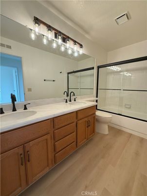 Bathroom, Dual Sink Vanities, Glass Shower, Interior, Wood Texture Flooring