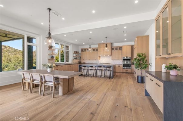 Dining room, Interior, Kitchen, Pendant Lights, Recessed Lighting, Stainless Steel Appliances, Wood Texture Flooring