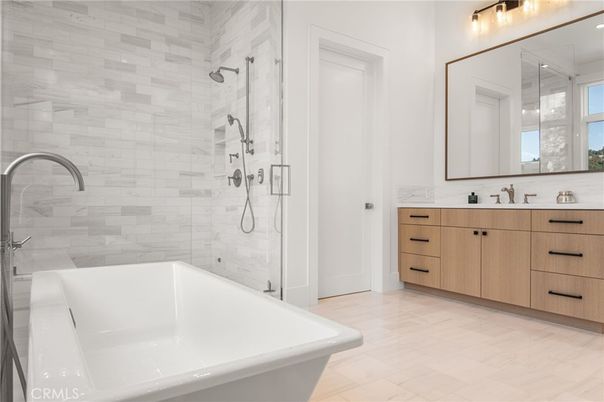 Bathroom, Dual Sink Vanities, Free Standing Baths, Glass Shower, Interior, Marble Walls, Wood Texture Flooring