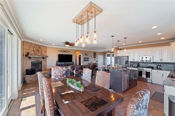 Dining room, Fireplace, Interior, Kitchen, Pendant Lights, Recessed Lighting, Stainless Steel Appliances, Stone Walls