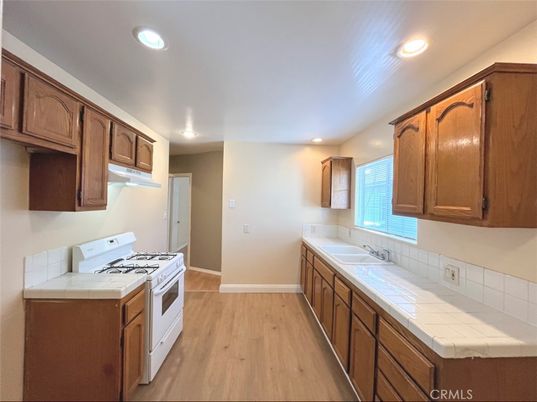 Interior, Kitchen, Recessed Lighting, Tile Countertops, Wood Texture Flooring