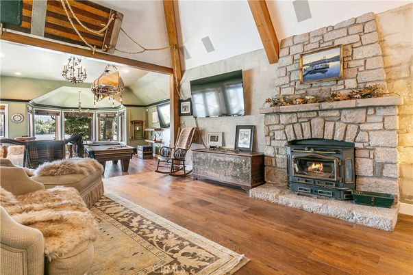 Billiard Table, Chandelier, Fireplace, Game Room, Interior, Living room, Recessed Lighting, Stone Walls, Wooden Beams, Wood Texture Flooring