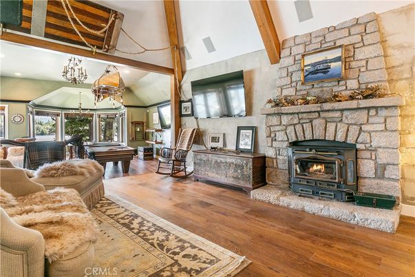 Billiard Table, Chandelier, Fireplace, Game Room, Interior, Living room, Recessed Lighting, Stone Walls, Wooden Beams, Wood Texture Flooring