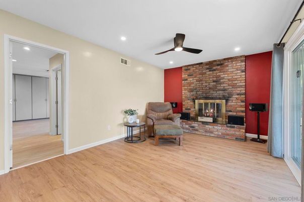 Empty room, Fireplace, Interior, Recessed Lighting, Stone Walls, Wood Texture Flooring