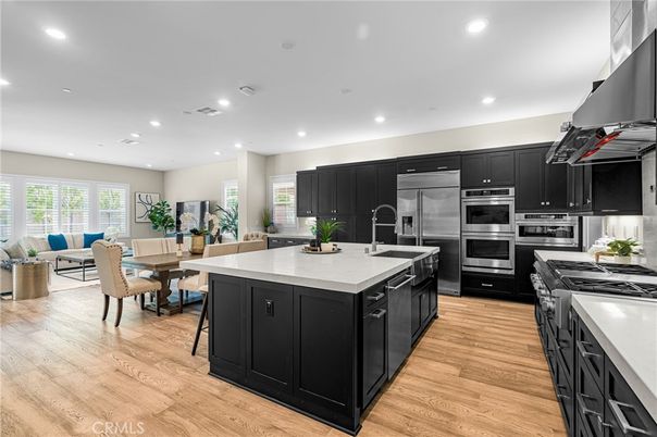 Dining room, Interior, Kitchen, Living room, Recessed Lighting, Stainless Steel Appliances, Wood Texture Flooring