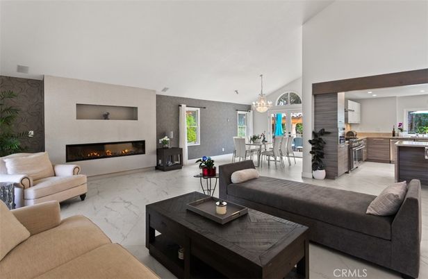 Chandelier, Dining room, Fireplace, Interior, Kitchen, Living room, Marble, Pendant Lights, Recessed Lighting, Stainless Steel Appliances, Wooden Beams