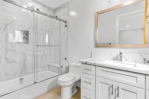 Bathroom, Glass Shower, Interior, Marble Walls, Recessed Lighting, Wood Texture Flooring