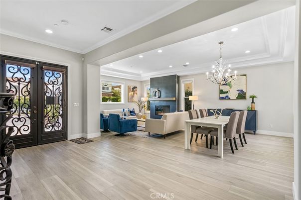 Chandelier, Dining room, Fireplace, Interior, Living room, Recessed Lighting, Wood Texture Flooring