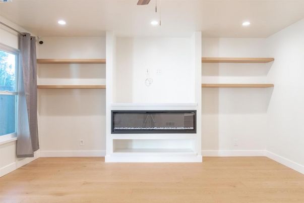 Empty room, Fireplace, Interior, Recessed Lighting, Wood Texture Flooring
