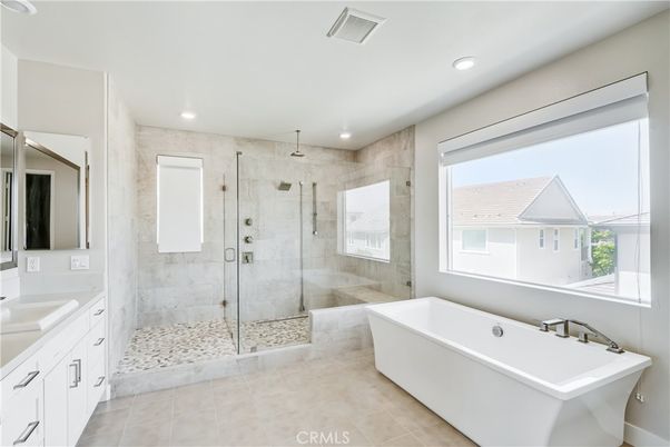 Bathroom, Dual Sink Vanities, Free Standing Baths, Glass Shower, Interior, Marble Walls, Recessed Lighting