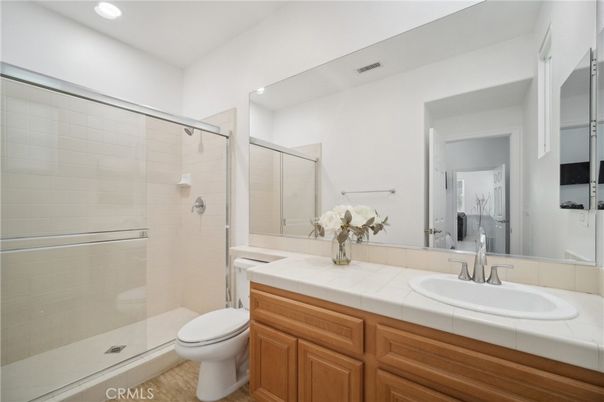Bathroom, Dual Sink Vanities, Glass Shower, Interior, Recessed Lighting, Tile Countertops