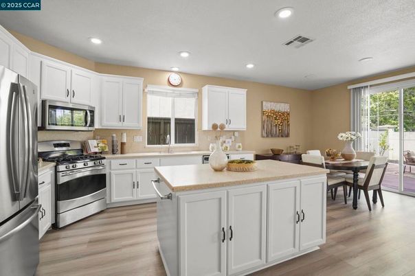 Dining room, Interior, Kitchen, Recessed Lighting, Stainless Steel Appliances, Wood Texture Flooring