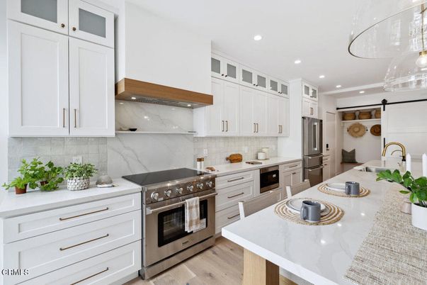 Interior, Kitchen, Marble Walls, Recessed Lighting, Stainless Steel Appliances, Wood Texture Flooring