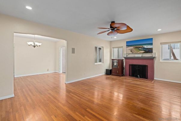 Chandelier, Empty room, Fireplace, Interior, Recessed Lighting, Wood Texture Flooring