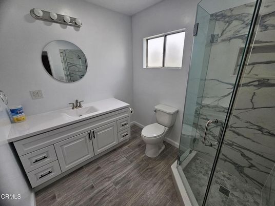 Bathroom, Glass Shower, Interior, Marble Walls, Wood Texture Flooring