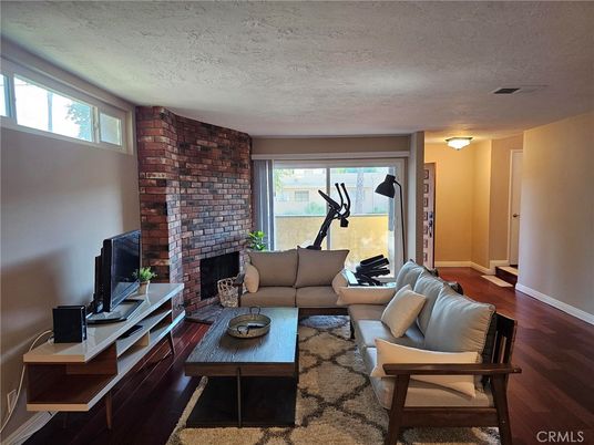Fireplace, Fitness Equipment, Interior, Living room, Stone Walls, Wood Texture Flooring