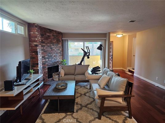 Fireplace, Fitness Equipment, Interior, Living room, Stone Walls, Wood Texture Flooring