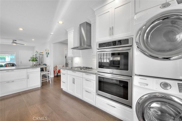 Interior, Kitchen, Recessed Lighting, Stainless Steel Appliances, Washer, Wood Texture Flooring
