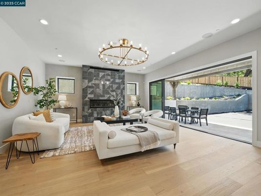 Chandelier, Dining room, Fireplace, Interior, Living room, Recessed Lighting, Wood Texture Flooring