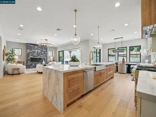 Dining room, Fireplace, Interior, Kitchen, Living room, Pendant Lights, Recessed Lighting, Stainless Steel Appliances, Wood Texture Flooring