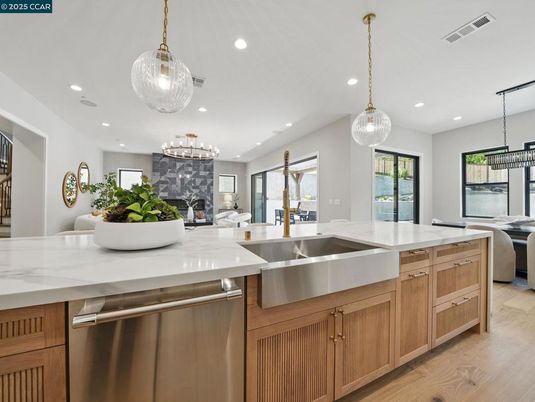 Fireplace, Interior, Kitchen, Living room, Pendant Lights, Recessed Lighting, Stainless Steel Appliances, Wood Texture Flooring