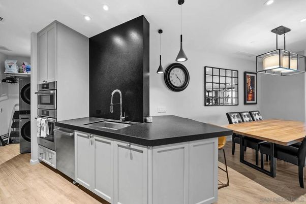 Dining room, Interior, Kitchen, Pendant Lights, Recessed Lighting, Stainless Steel Appliances, Wood Texture Flooring