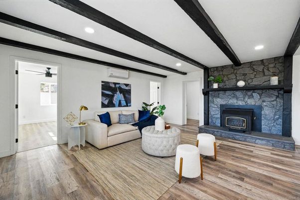 Fireplace, Interior, Living room, Recessed Lighting, Stone Walls, Wood Texture Flooring
