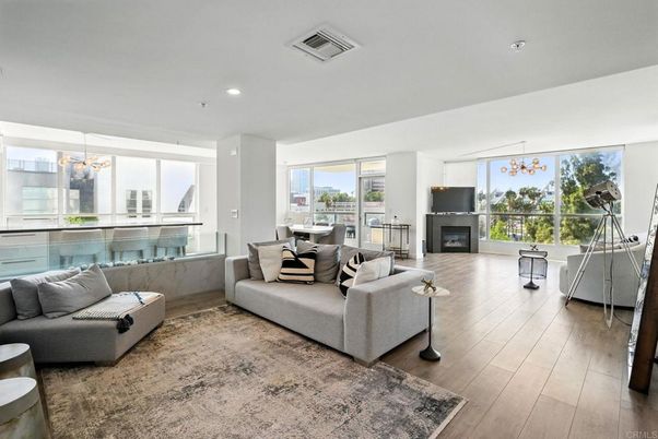 Dining room, Fireplace, Interior, Living room, Pendant Lights, Recessed Lighting, Wood Texture Flooring