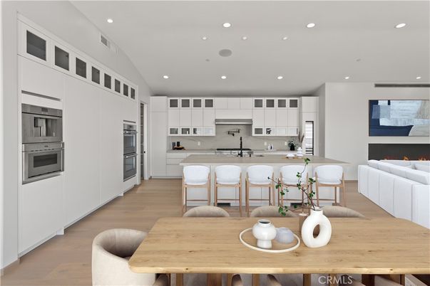 Dining room, Fireplace, Interior, Kitchen, Recessed Lighting, Stainless Steel Appliances, Wood Texture Flooring