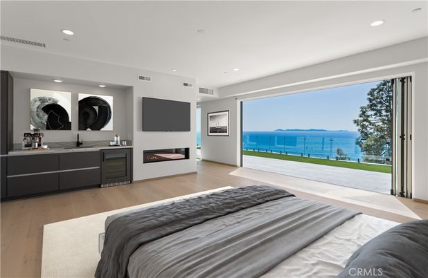 Bedroom, Fireplace, Interior, Recessed Lighting, Water, Wood Texture Flooring