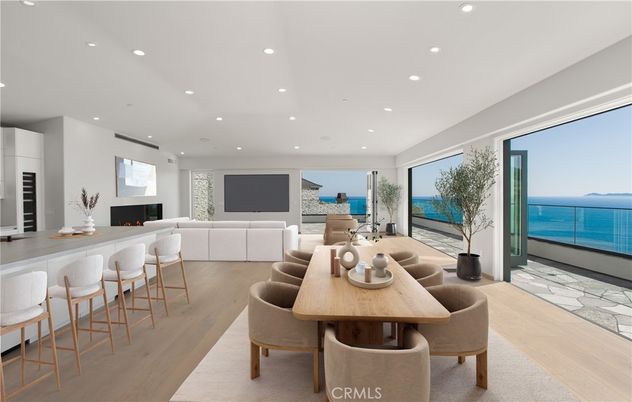 Dining room, Fireplace, Interior, Living room, Recessed Lighting, Water, Wood Texture Flooring
