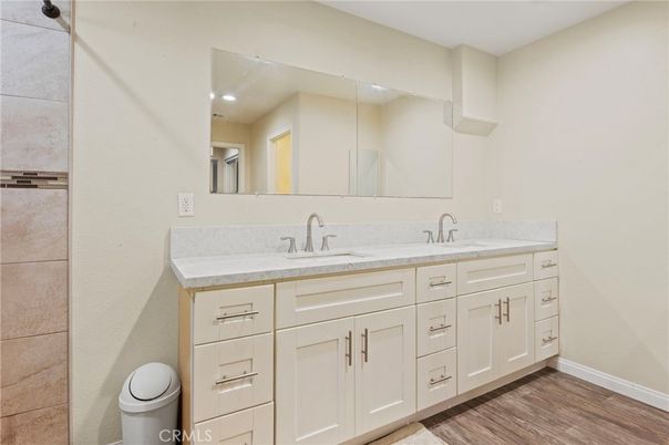 Bathroom, Dual Sink Vanities, Interior, Recessed Lighting, Wood Texture Flooring