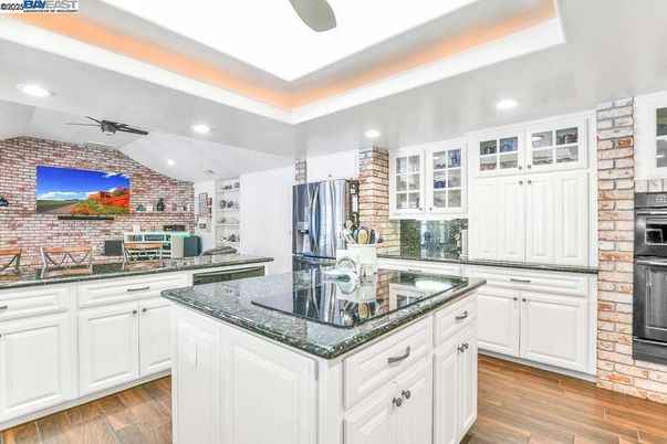 Interior, Kitchen, Recessed Lighting, Stainless Steel Appliances, Stone Walls, Wood Texture Flooring