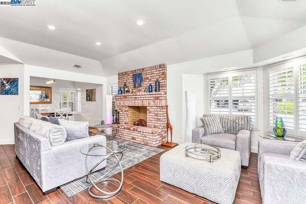 Fireplace, Interior, Living room, Recessed Lighting, Stone Walls, Wood Texture Flooring