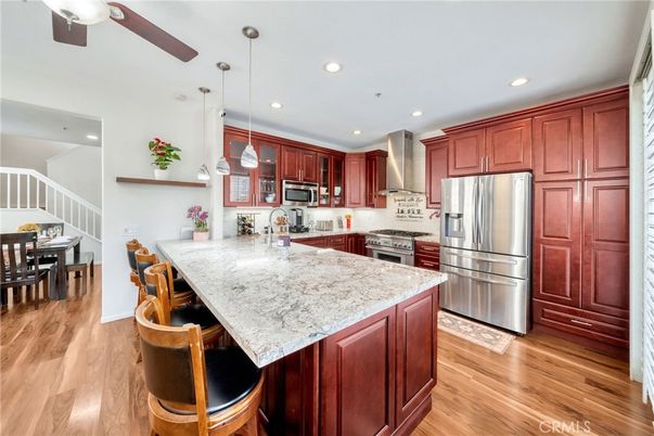 Dining room, Interior, Kitchen, Pendant Lights, Recessed Lighting, Stainless Steel Appliances, Wood Texture Flooring