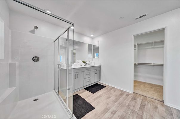 Bathroom, Dual Sink Vanities, Glass Shower, Interior, Recessed Lighting, Walk-in Closets, Wood Texture Flooring