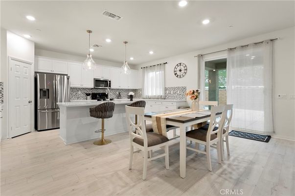 Dining room, Interior, Kitchen, Pendant Lights, Recessed Lighting, Stainless Steel Appliances, Wood Texture Flooring